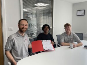 Josh, a work experience student, sat between two people from the Start Tech team in their meeting room