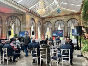 People sitting down for the start of the expo