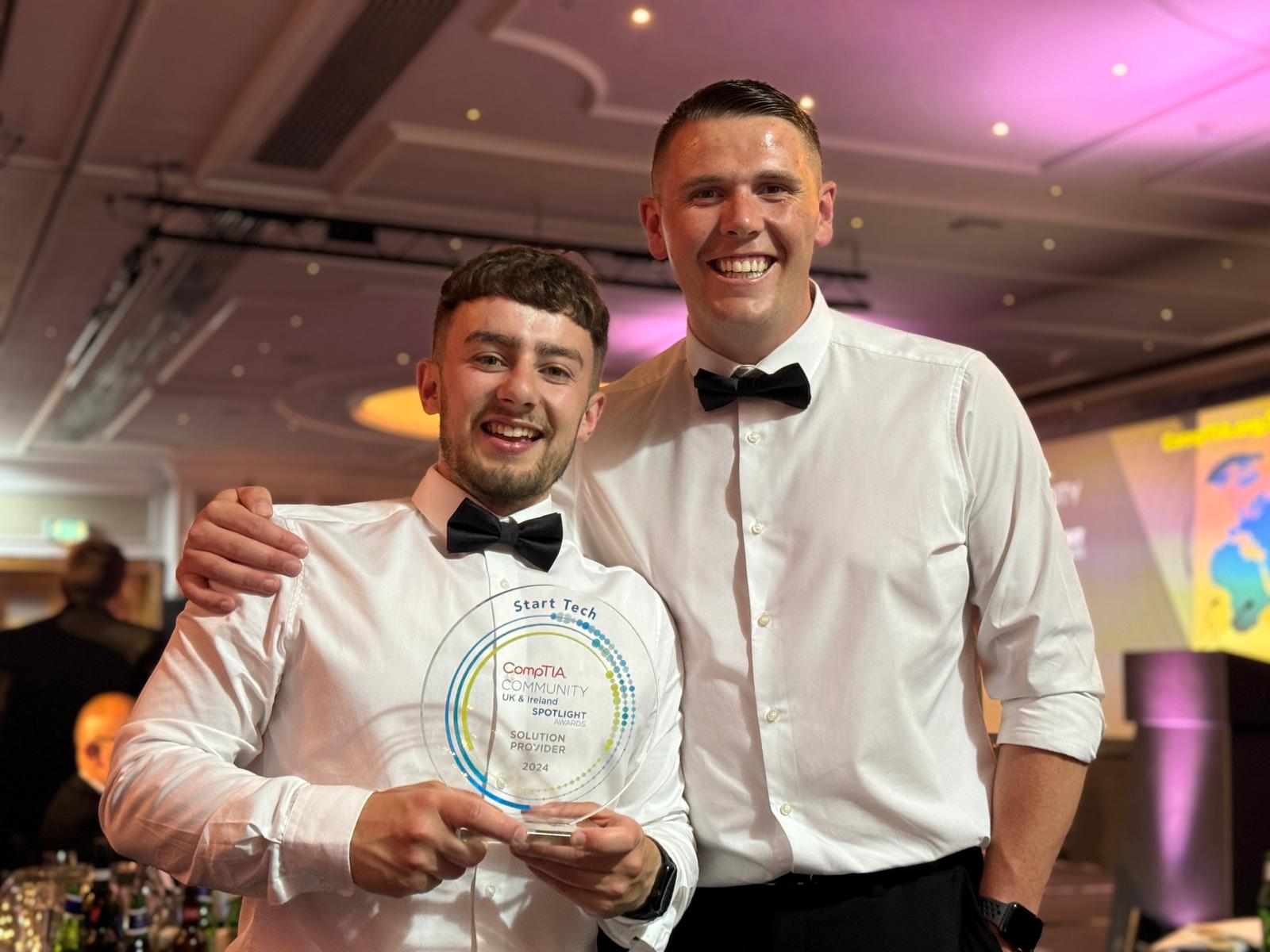 Jordon and Kieran holding an award